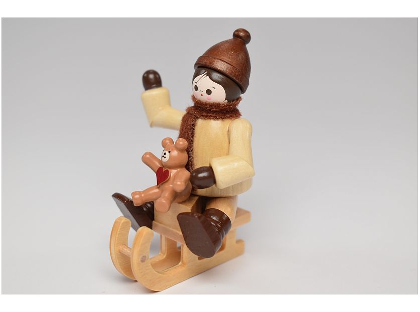 Romy Thiel – Winter child with teddy on sled