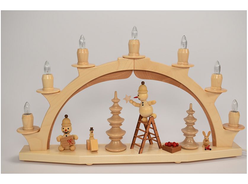 Wagner - Candle arch / candle arch Junior on ladder while decorating