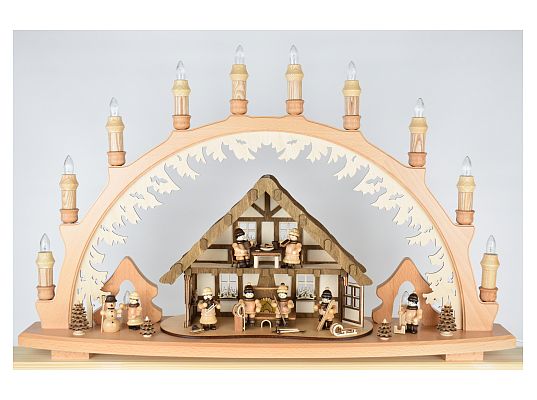 Lenk - candle arch house of the Ore Mountains with winter children and light